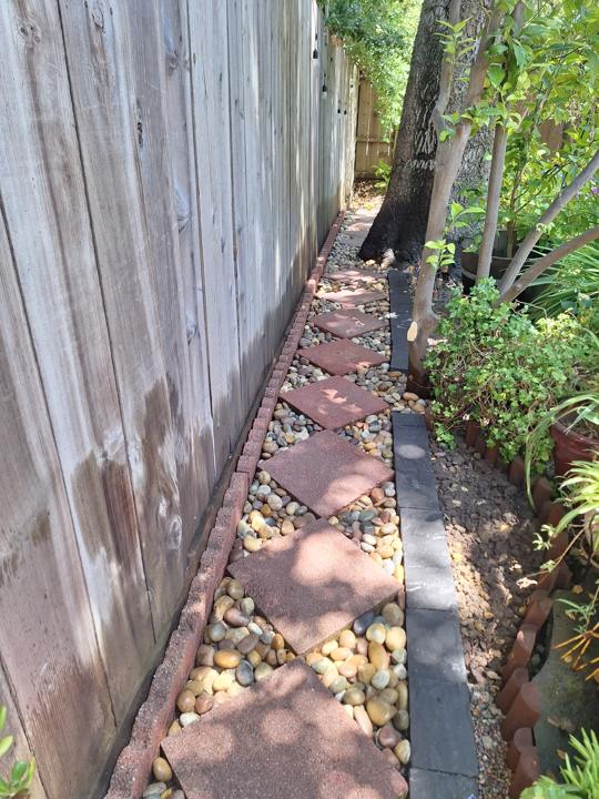 Side-yard path with pavers, river rock and edging